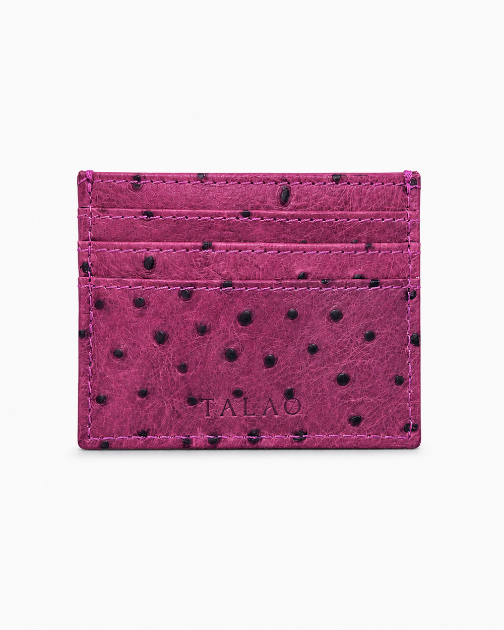Pink cardholder with black polka dots on a white background
