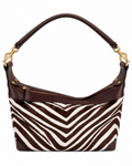 Handbag with zebra pattern and brown leather accents on a white background