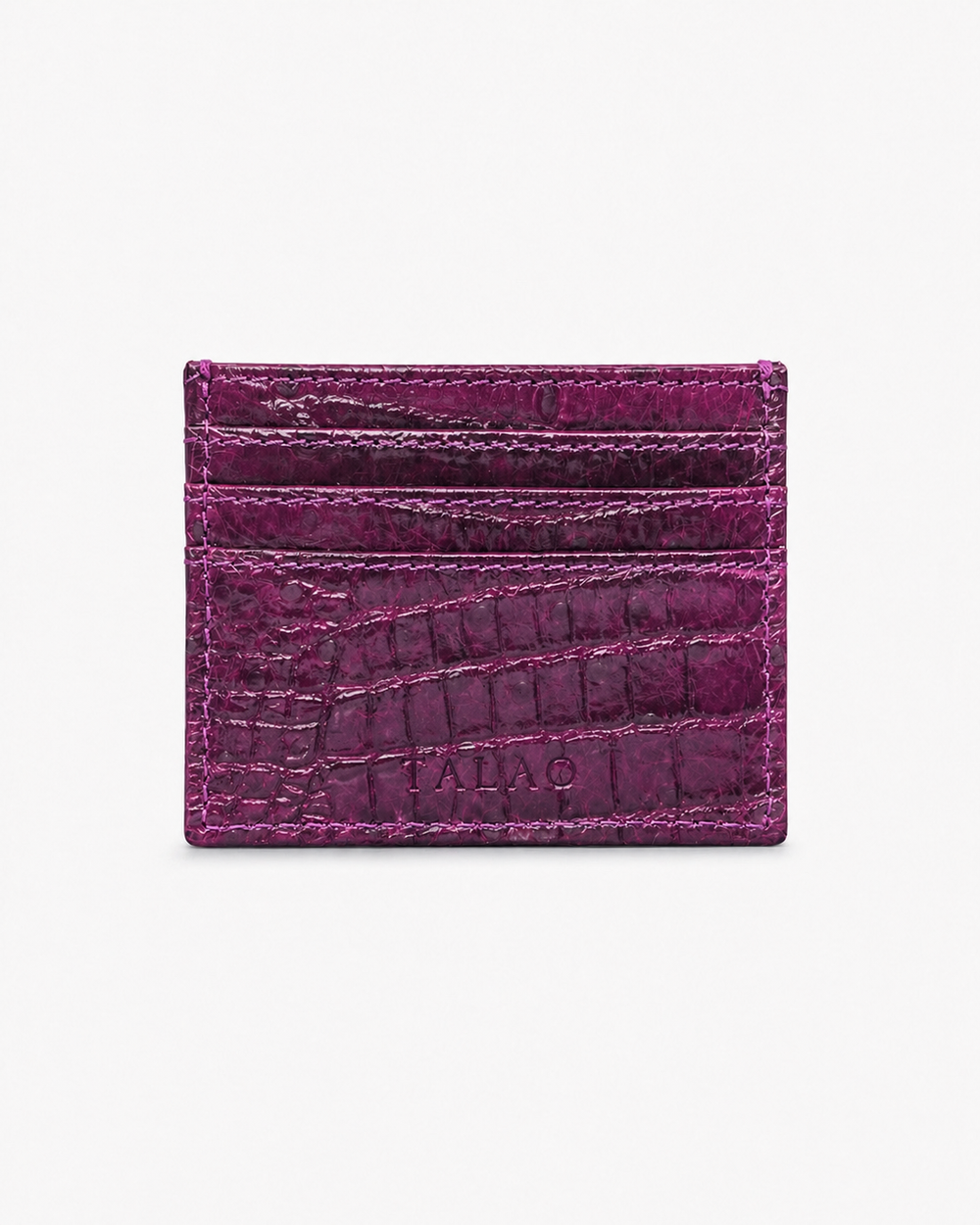 Purple cardholder with crocodile texture on a white background
